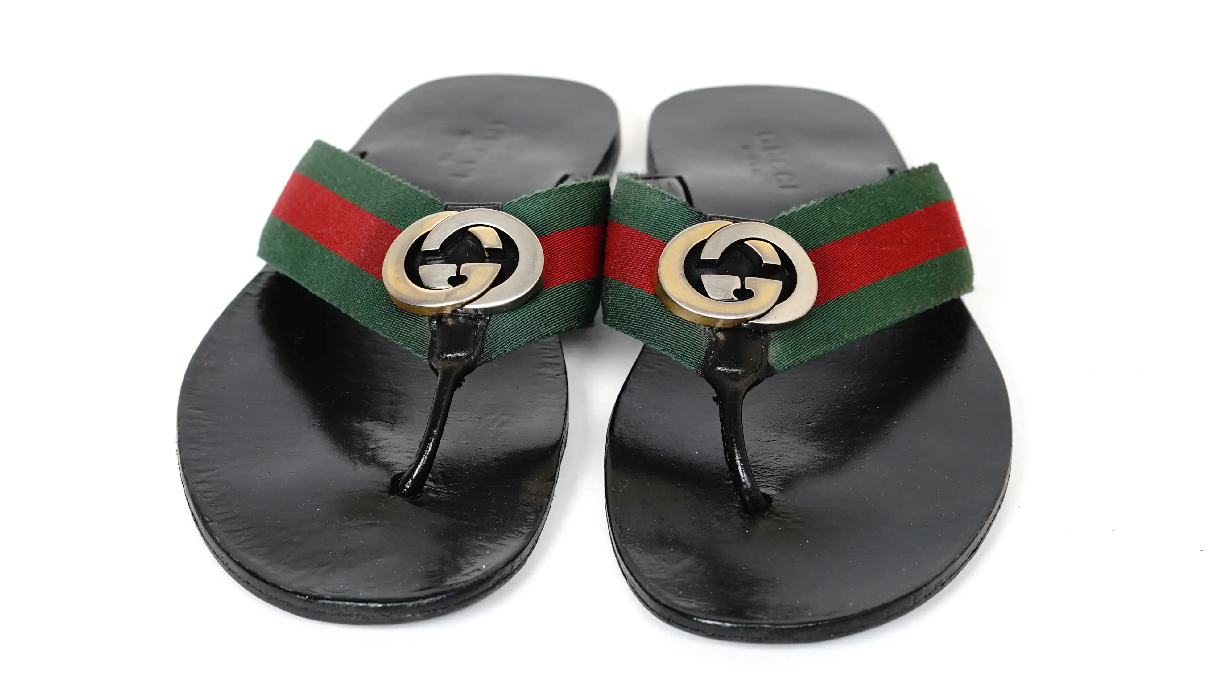 Before Gucci slippers restoration discoloured PU surface with visible cracks and dull tone