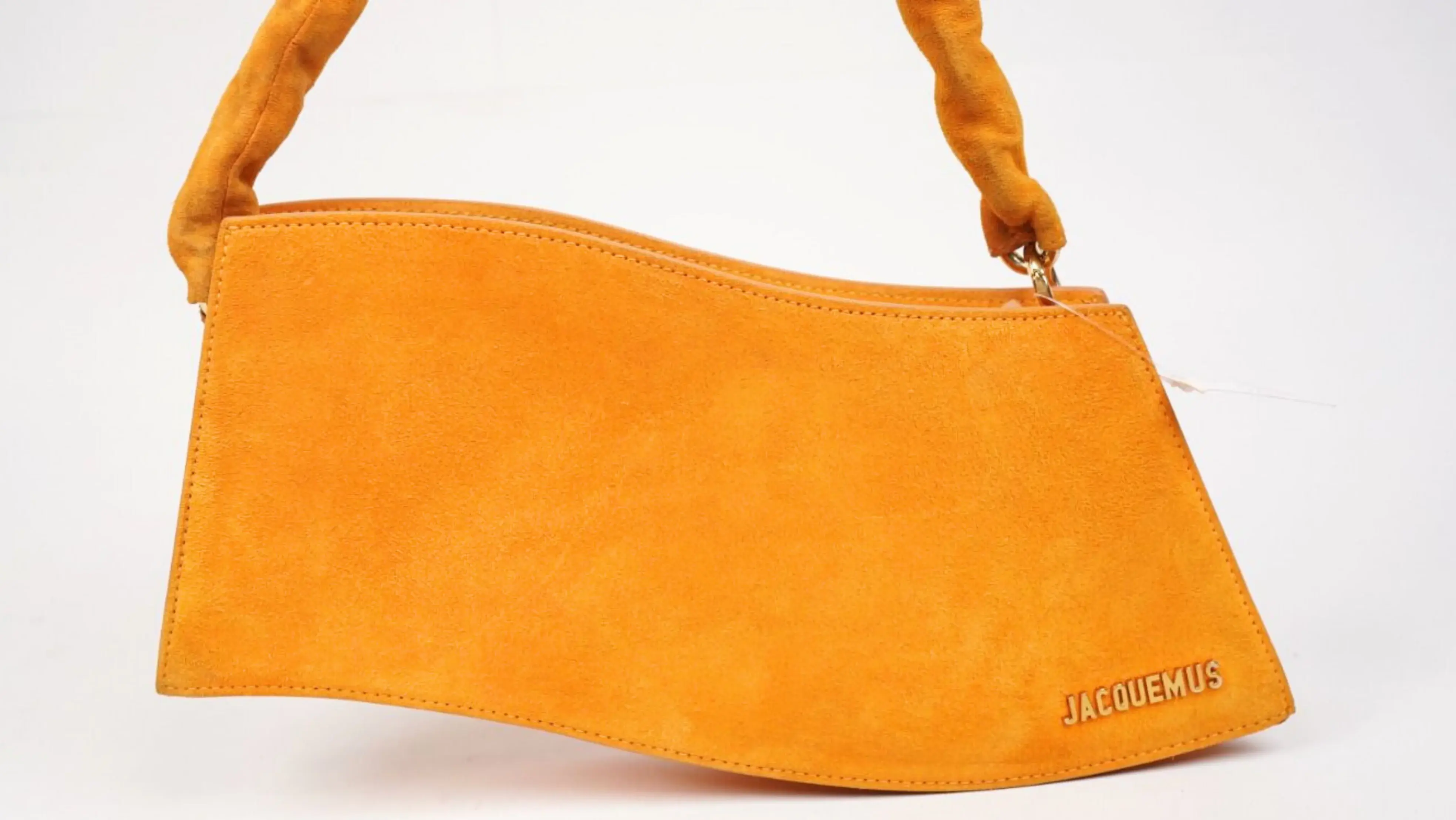 Before Jacquemus suede bag cleaning Delhi showing dirt and surface dullness