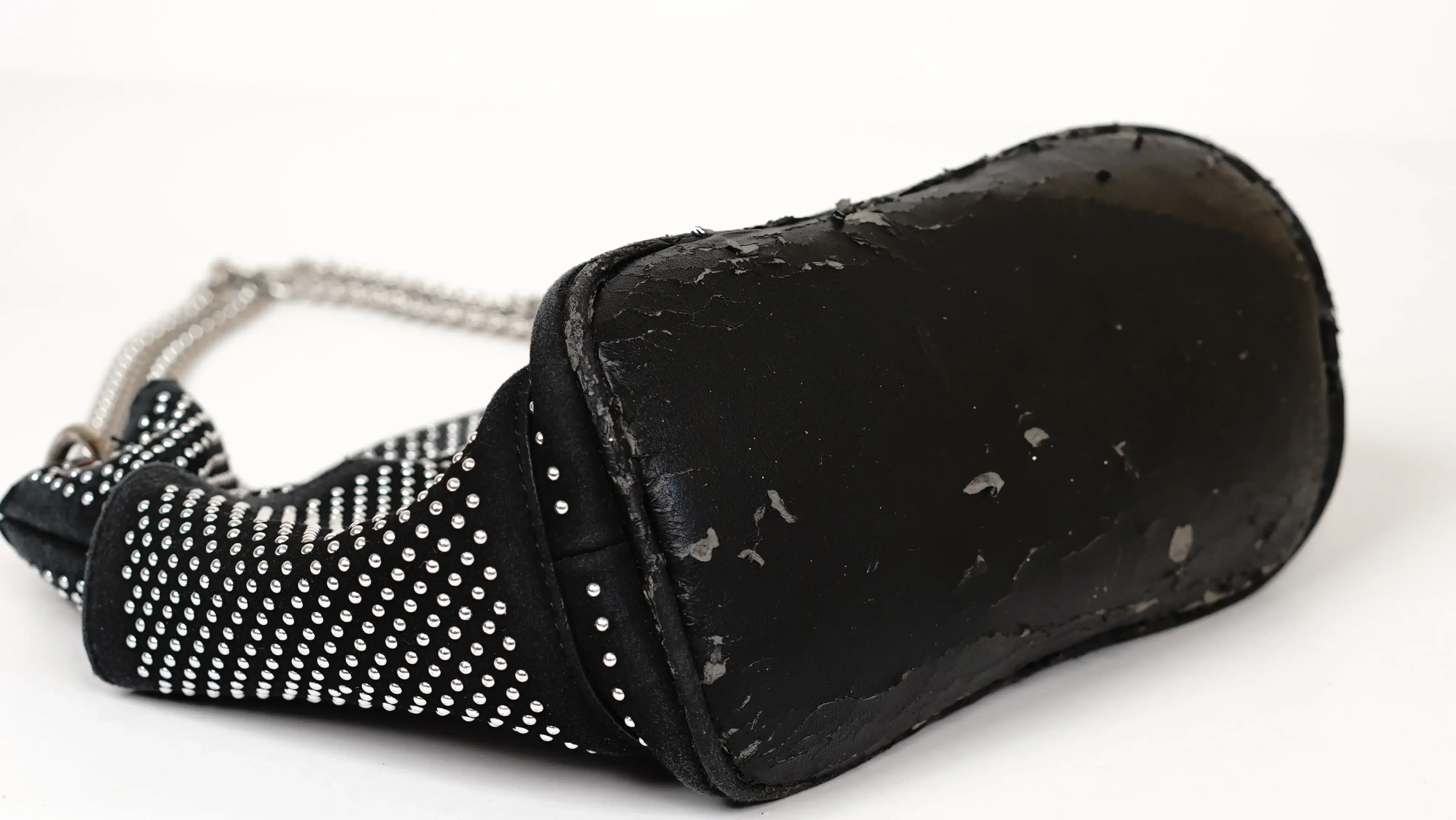 After Jimmy Choo handbag restoration renewed PU panel seamlessly blended with original finish